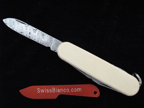 Damascus with Ivory Micarta Scales